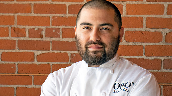 shawn cox wearing an obo chef's coat with his arms crossed